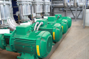 Group of four powerful pumps in a modern boiler-house