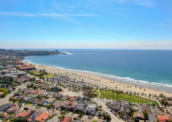 Aerial view of La Jolla coastline with nice small waves and beautiful villas. La Jolla, San Diego, California, USA. Beach with pacific ocean